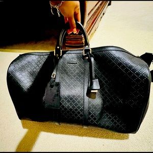 Authentic and stunning! Men's black Italian leather Gucci duffel bag.
